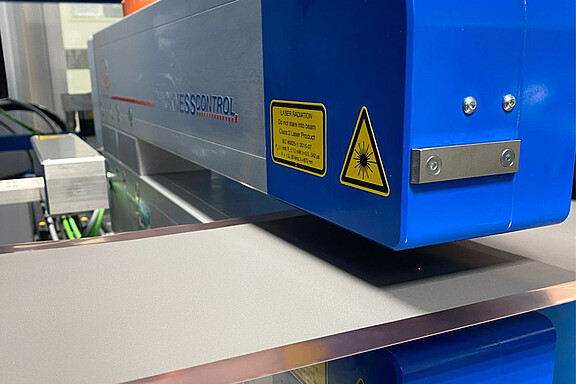 Optical thickness measurement of battery film